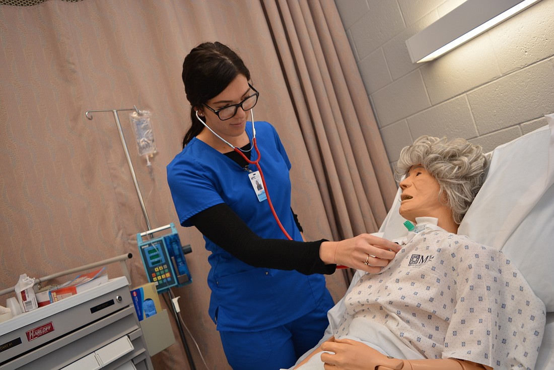 Mill Creek resident Monica Clifford practices checking vital signs on a mannequin at Manatee Technical College, where she is studying in the licensed practical nursing program. She hopes to later become a registered nurse.