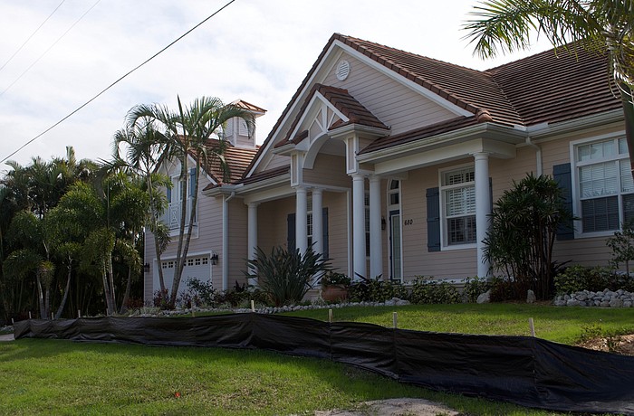 Front yards have been dug up for new piping