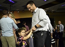 Dan LeClair dances with his preschooler daughter, 5-year-old Lydia, at McNeal Elementary's "Sweetheart Dance."