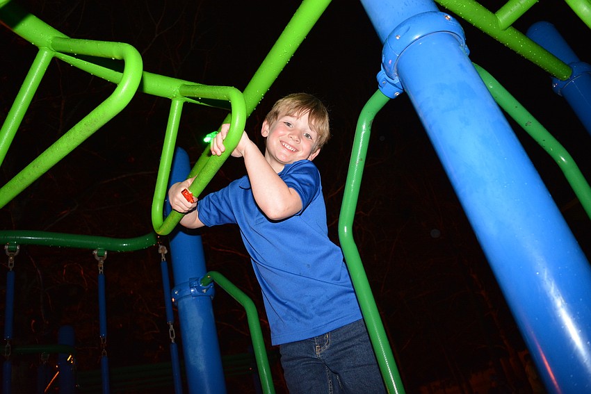Prekindergarten student Trenton Layport, 5,  considers tackling the monkey bars but decides on something easier.
