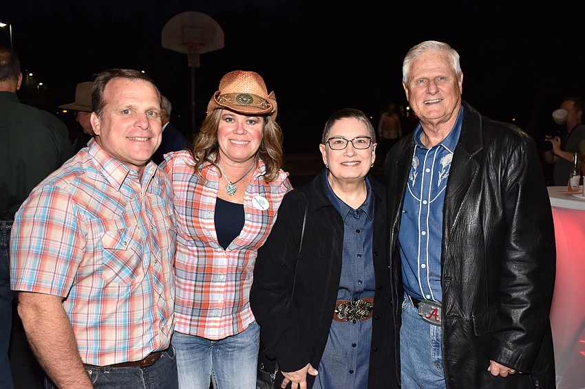 Robyn and President and CEO Bill Sadlo with Lynne and Honoree Mack Reid