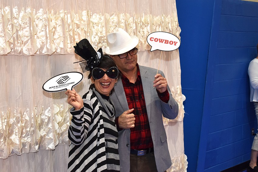 Vanessa Sueir and Jose Tase pose in the photo booth.
