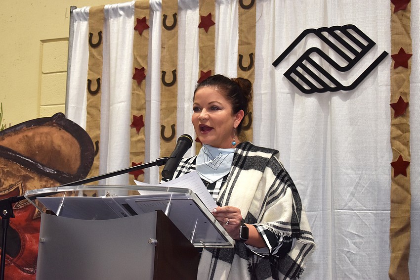 Board Chairwoman Jonna Keller welcomes guests.