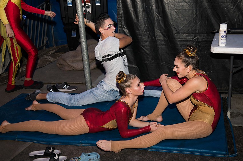 The Sailor Circus stars stretch before going in the ring.
