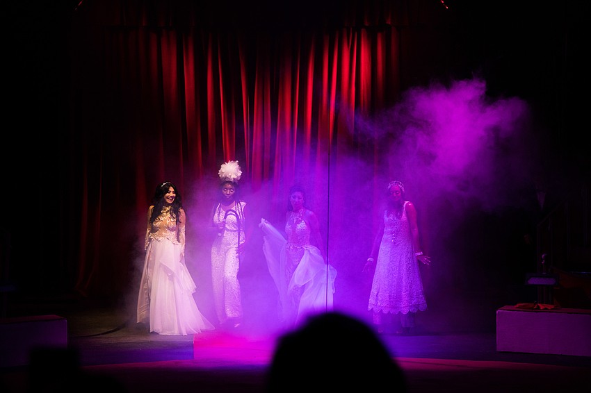 The co-chairwomen made their appearance out of smoke.