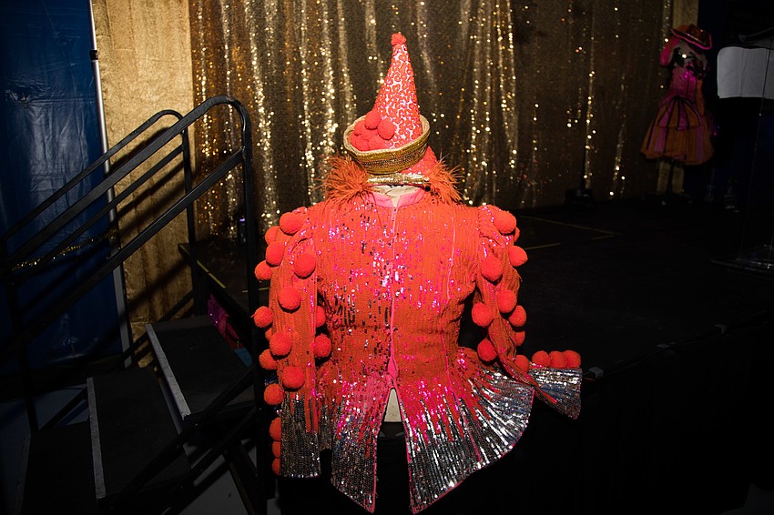 A vintage circus uniform decorated the stage.