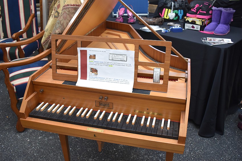 Various antiques, like this piano, were for sale.