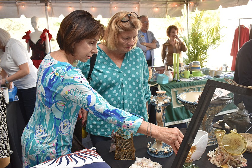 Jeanne Graham and Jane Nutter-Johnson check out the wares.