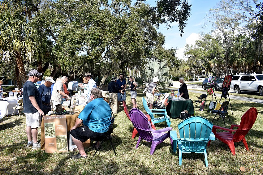 Artists, authors and enthusiasts gather on the lawn of the Longboat Library for the festival.