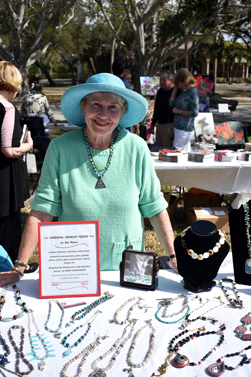 Sue Reese poses with her handmade jewelry.