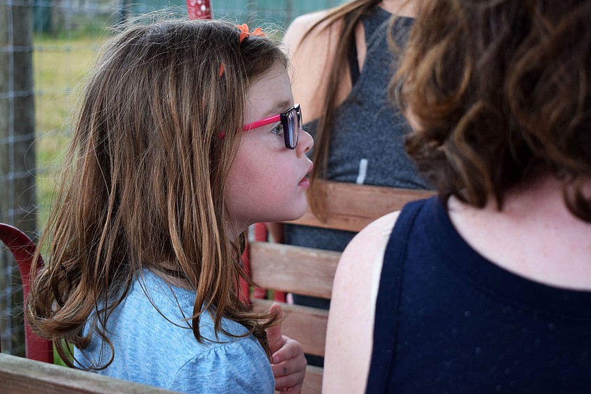 Four-year-old Sophia Reisdorf enjoys a train ride with her mom, Sara Reisdorf.