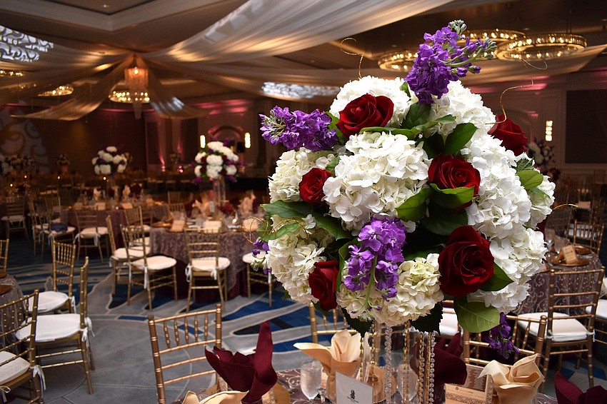 Floral arrangements centered all the tables.