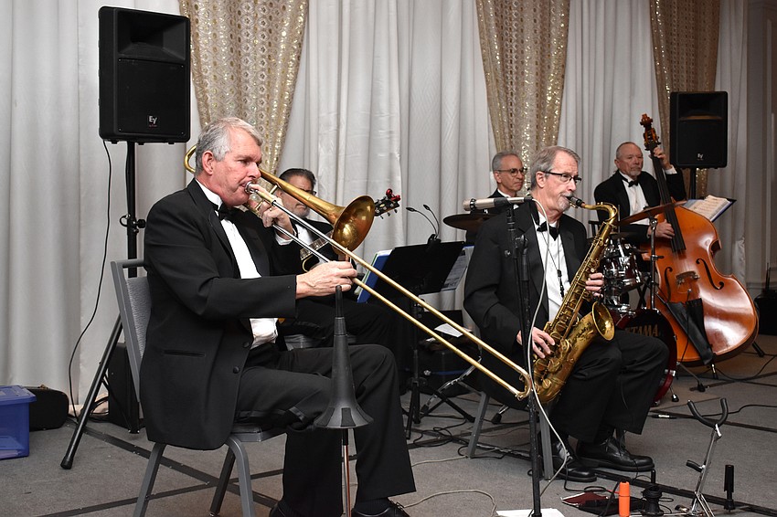 Musicians greeted guests with live music as they entered the ballroom before dinner.