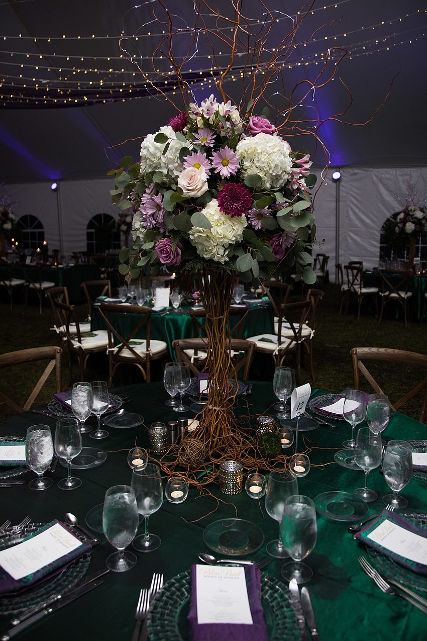 The centerpieces stood high above the tables.