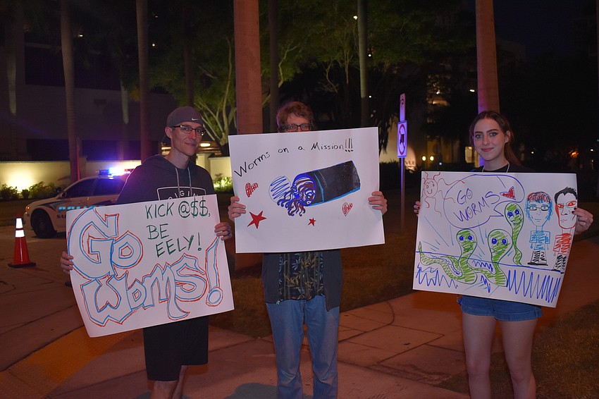 Jochen Hutzenlaub, Josh Buegner and Brianna Augustine cheer on their family member.