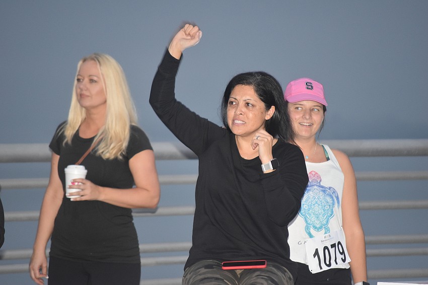 Runners were greeted with cheers from people like Mary Khoshi.