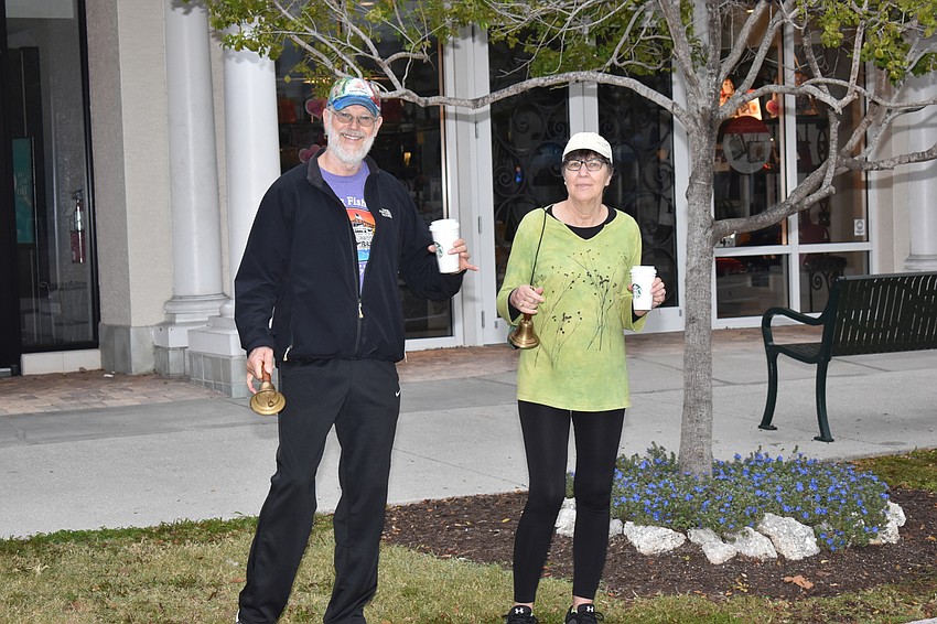 Joel Shoemaker and Becky Kobos rang bells for the runners.