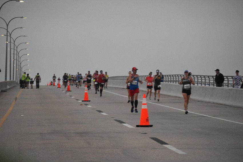 The day is dreary but the weather is perfect for running.