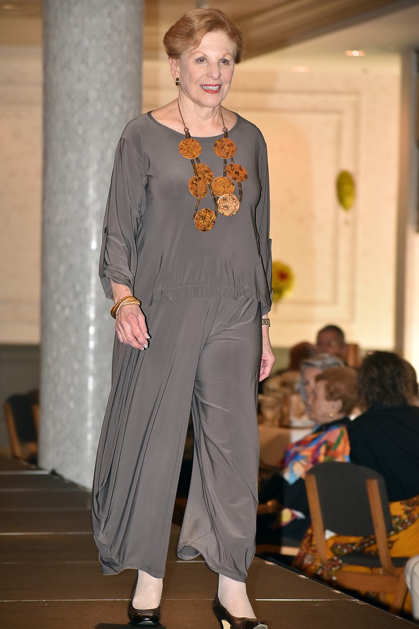 Sandy Krause walks the runway modeling clothes from Natural Discoveries.