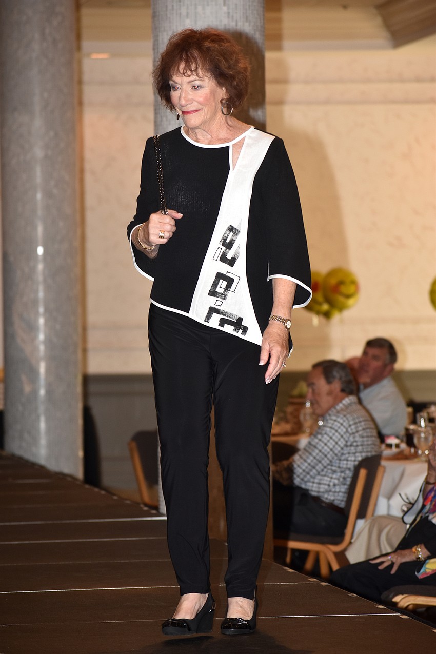 Robin Green poses on the runway as she models clothes from Natural Discoveries.