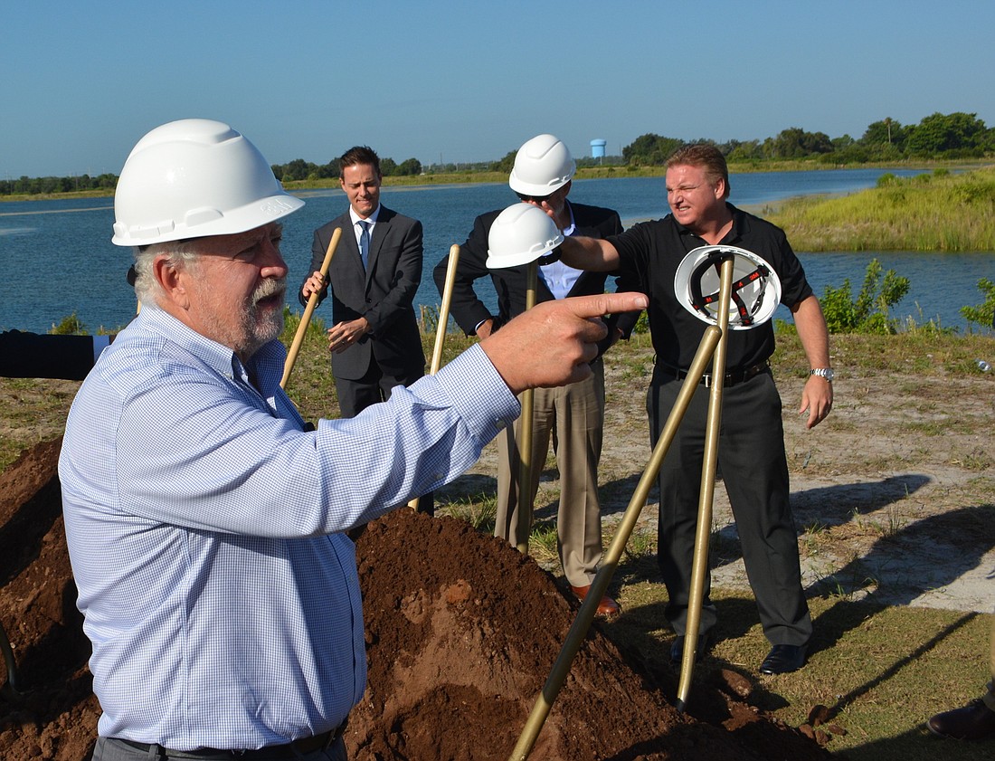 SMR CEO and President Rex Jensen breaks ground on Waterside Place in October. Four new tenants were announced this week.