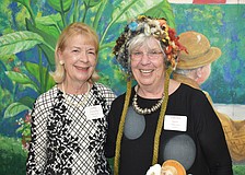 Judy O'Donnell with Carole Reiss, who is modeling a hat she made in needlepoint.