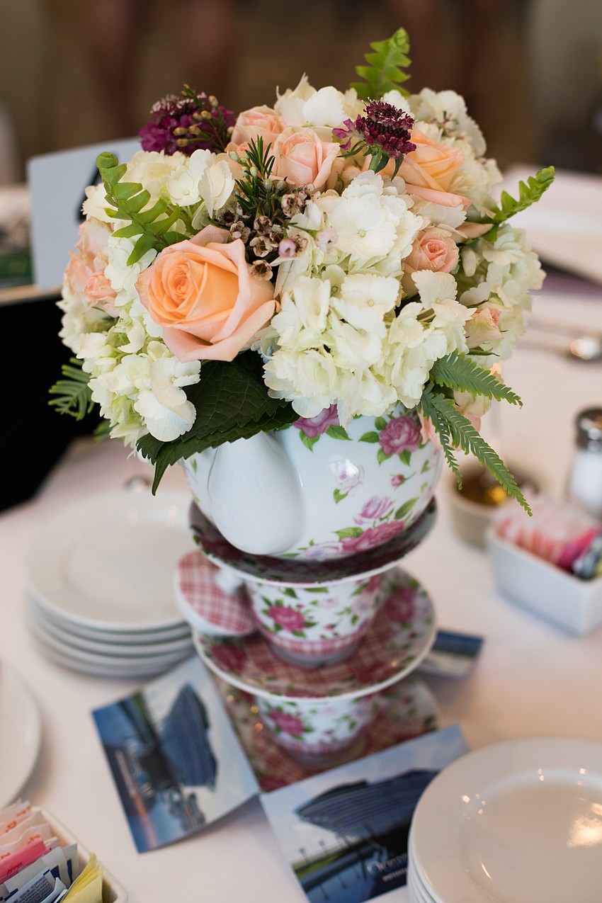 The centerpieces were floral decorated tea kettles.