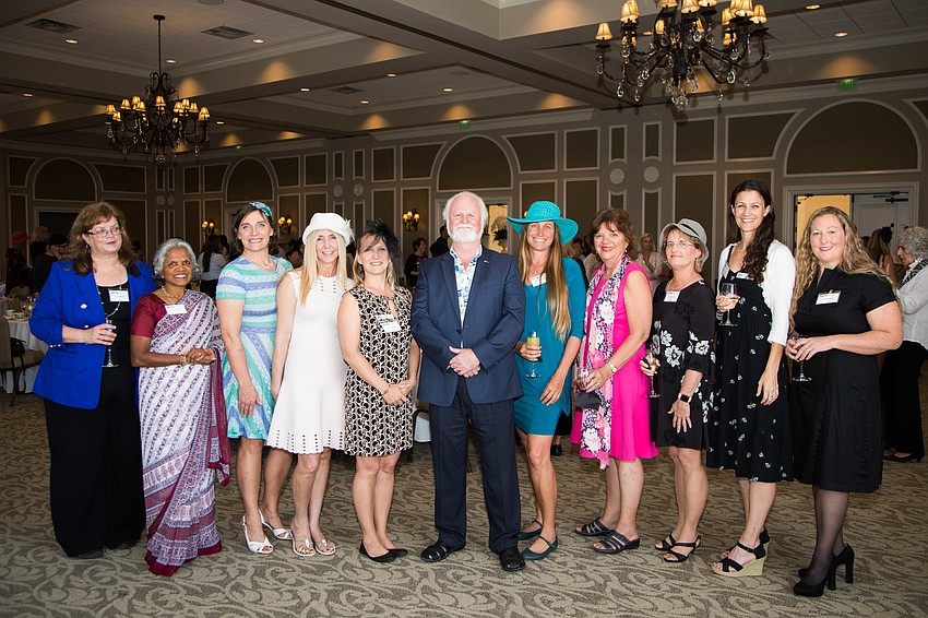 Michael P. Crosby with the Mote scientists.