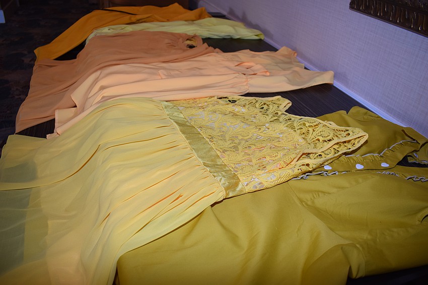 Dressers were available for people to slip into to take pictures with Robert Forte.