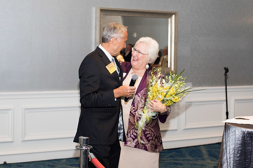 Tom Stuhley gives flowers to his wife and Chairwoman Cindy Stuhley during the VIP sponsor reception.