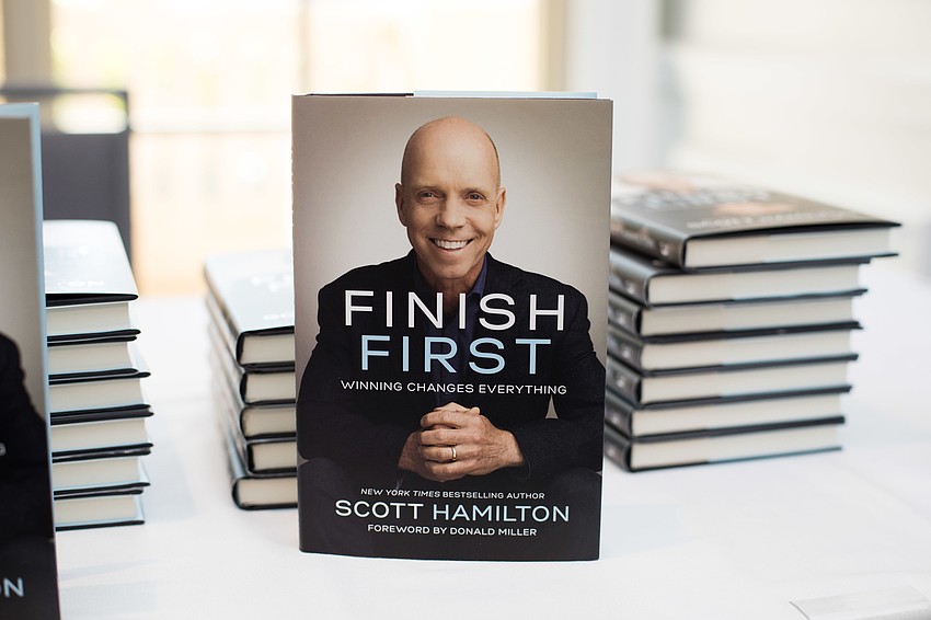 Guests could purchase Scott's book and have it signed after the luncheon.