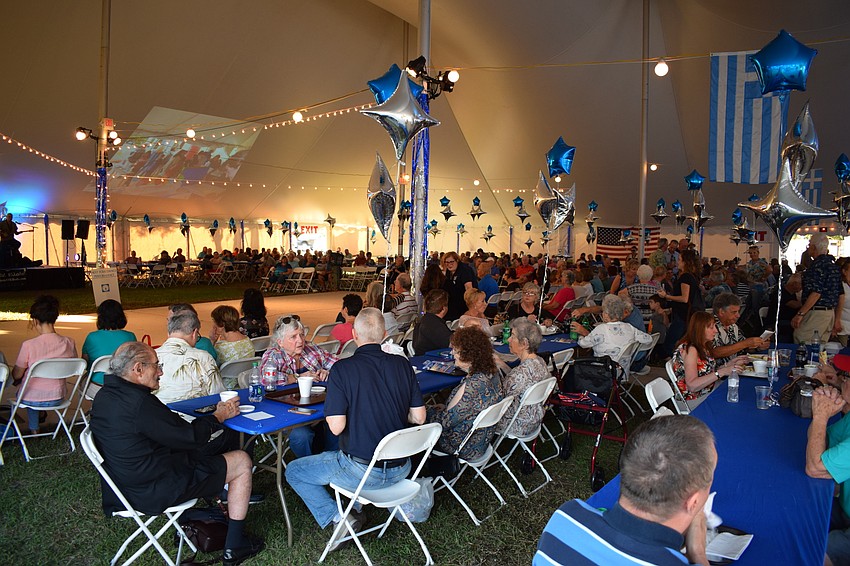 Festival-goers packed the tent prior to a performance from young Greek folk dancers.