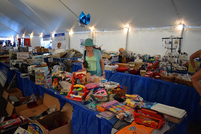 Judi Nofs, of Laurel Park, browses wares in 