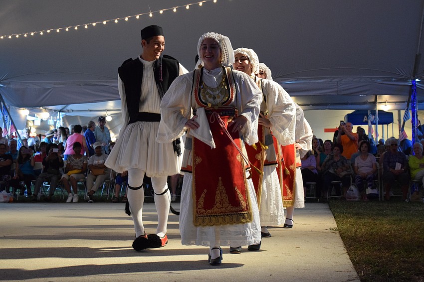 Dancers share a smile in the midst of their performance.