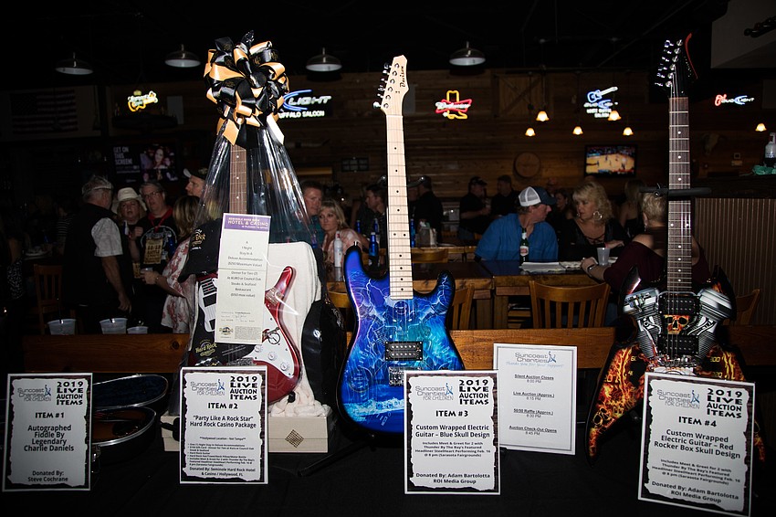 The live auction included guitars.