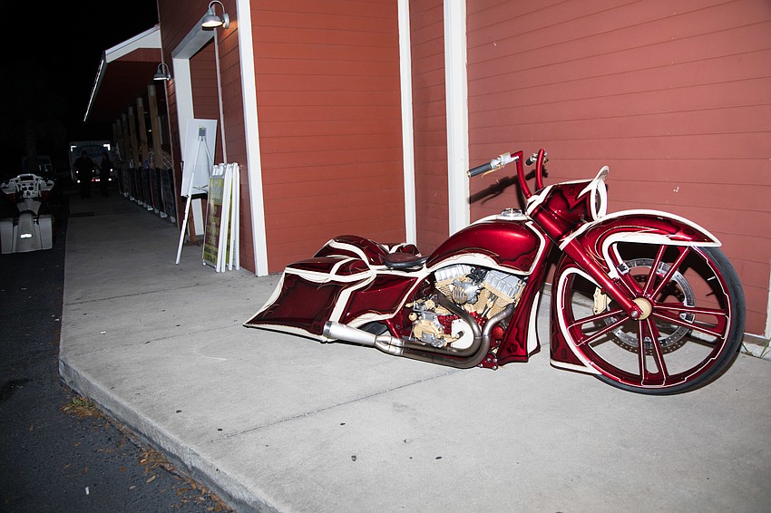 Motorcycles sat outside the saloon.