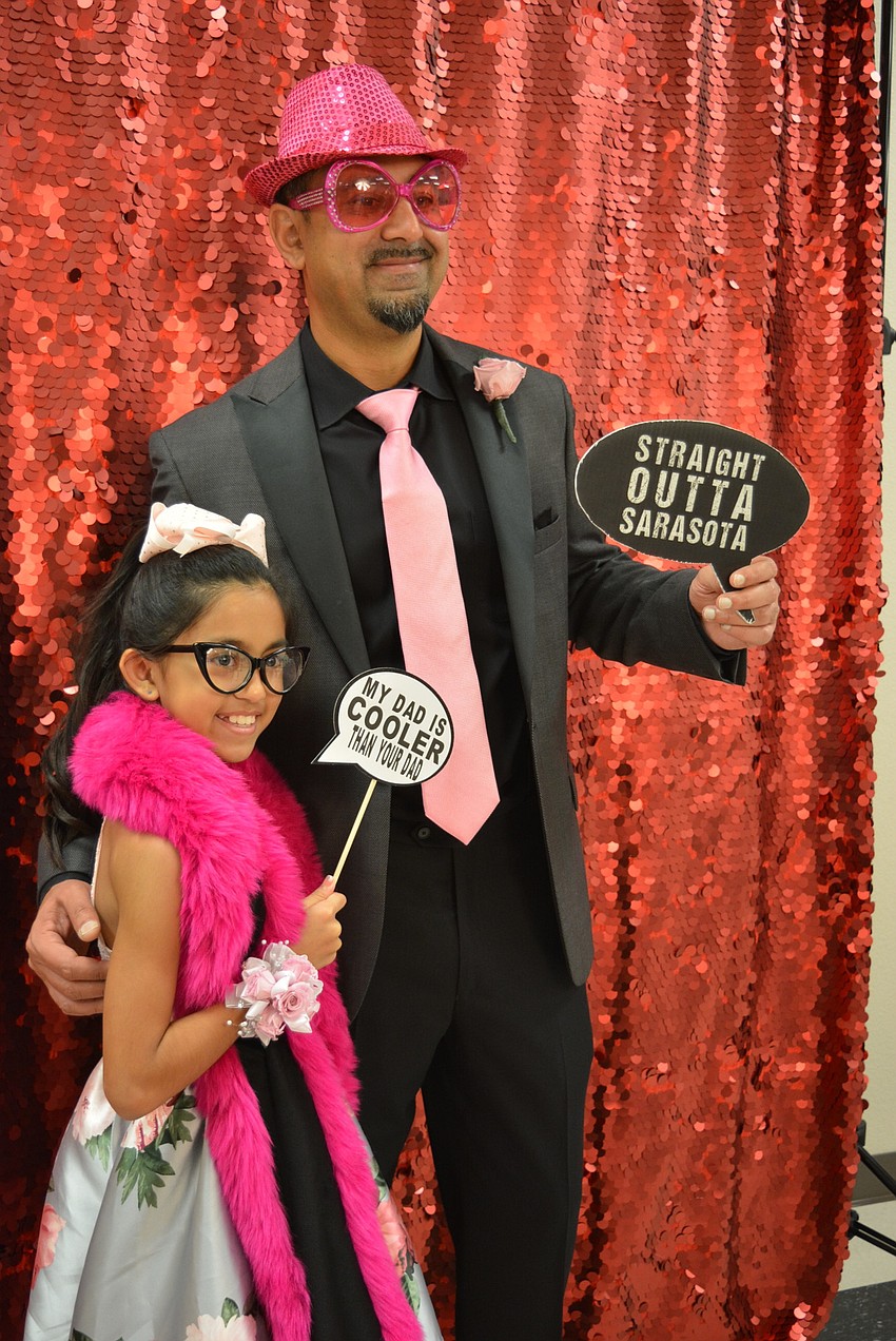Sonya and Prashant Pandya pose for a silly picture. Sonya picked out her dad's hat and glasses.