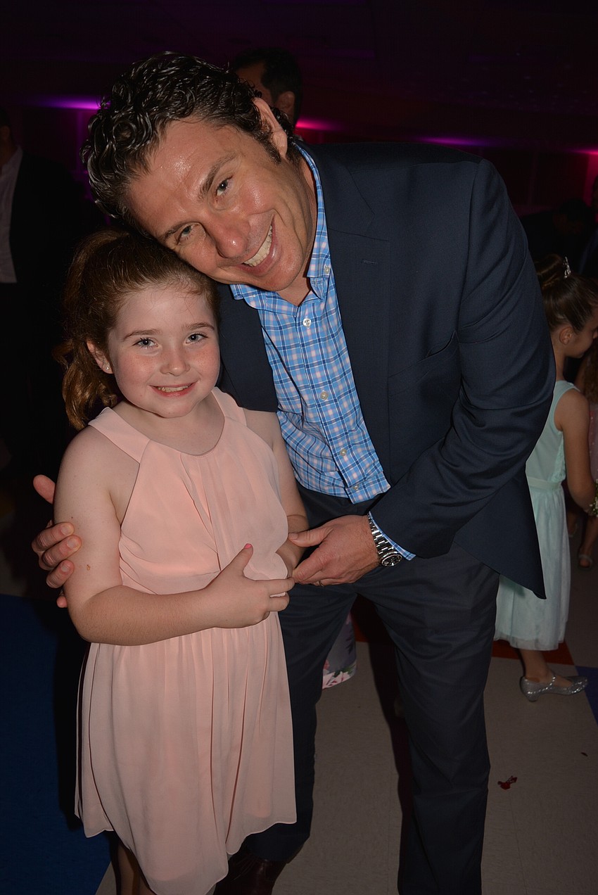 Second-grader Drea Graziano says she likes dancing with her dad, Jamie Graziano.