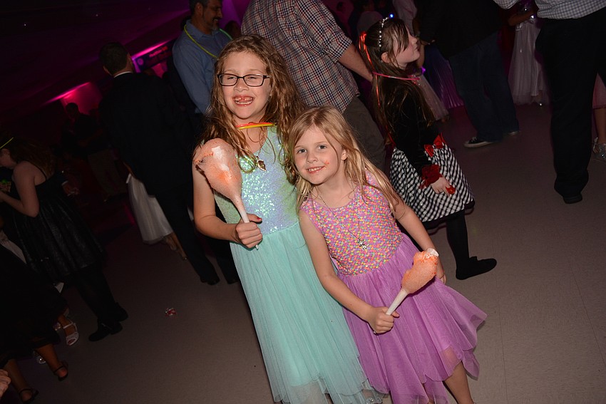 Second-grader Ashleigh and kindergartener Abby VanAntwerp made sure to load up on cotton candy before hitting the dance floor.