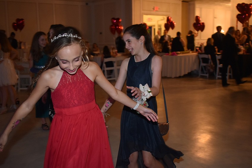 Ana Benson and Gabriella Hollingsworth lead the way onto the dance floor.