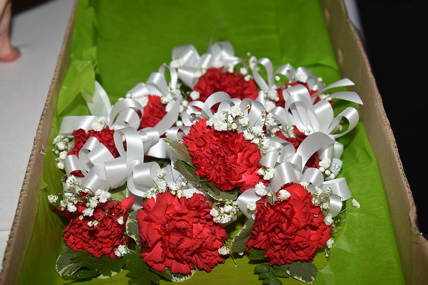 Carnations were given out to fathers and daughters as they walked through the doors.