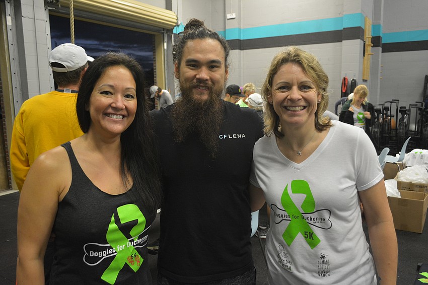 Rebekah Boudrie, Josh Davis and Monaka Oberer get together before the crush begins. Boudrie and Oberer are race organizers while Davis donated his CrossFit Lena gym for the event.
