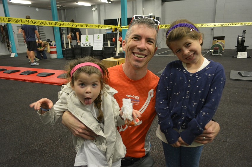 Volunteers Cora, Jordan and Zoe Baszmer of Windermere were some of the first to arrive before the sun came up.