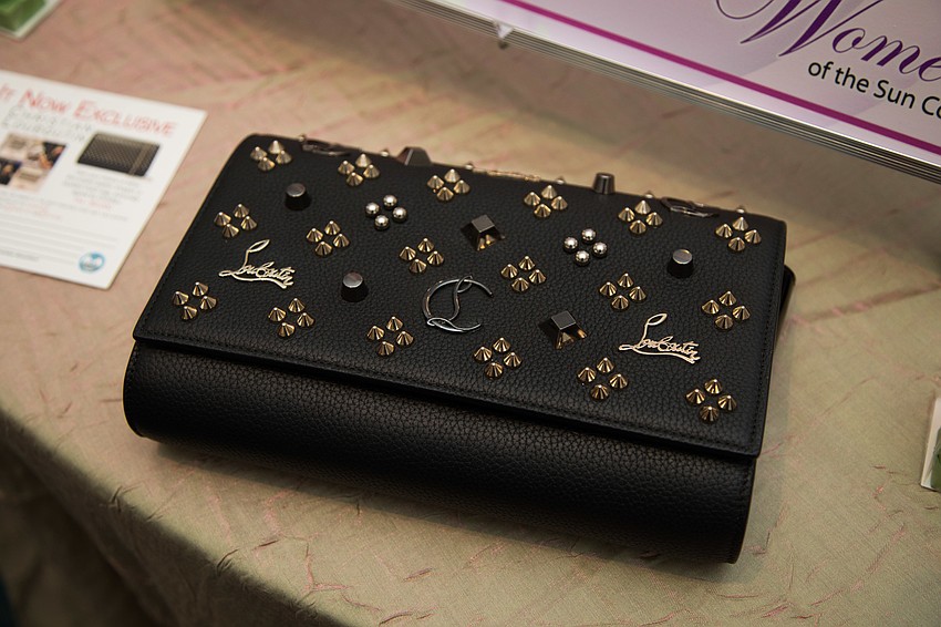 This signed Louboutin clutch was one of the live auction items.