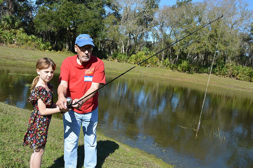 Bradenton 7-year-old Mya Neilson has great aim her first time casting with the help of angler Rich Brenner.