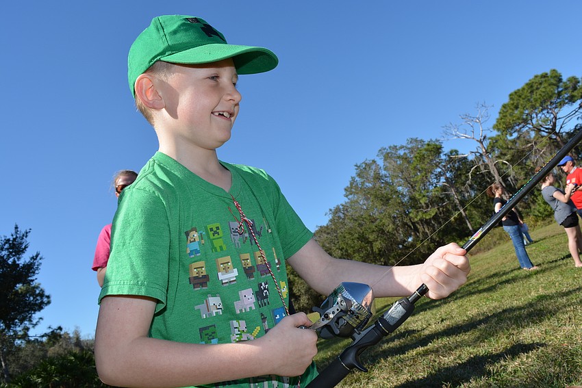Greenbrook's Macoy Kmetz, 8, was excited to learn how to fish. His mom, Tanya Perry, was learning, too.