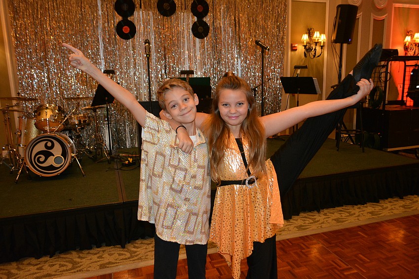 Sarasota twins Gabe and Liv Tunks entertained the crowd with 1970s dance moves.