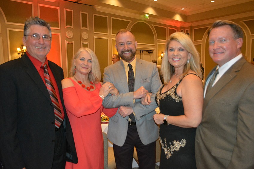 David and Hope Carey, Players Artistic Director Jeffery Kin and Peggy Kronus and Jerry Lamb are smitten with The Players fundraiser at Lakewood Ranch Country Club.