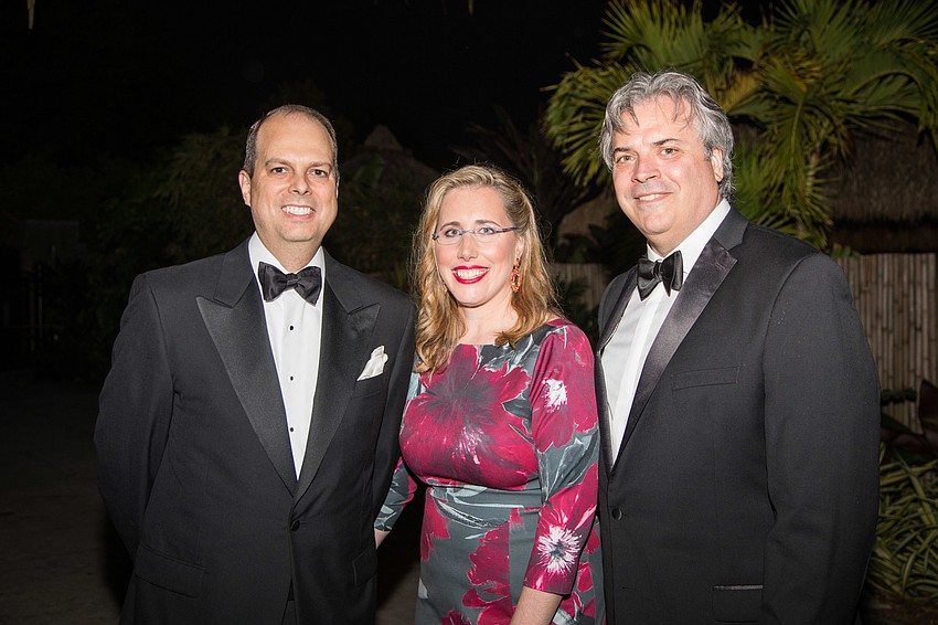 Mike Wilson with CEO and President Jennifer and Rob Rominiecki