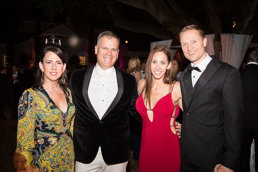 Clara Reynardus de Villanueva and Roberto Villanueva with Jaime and Adam Still